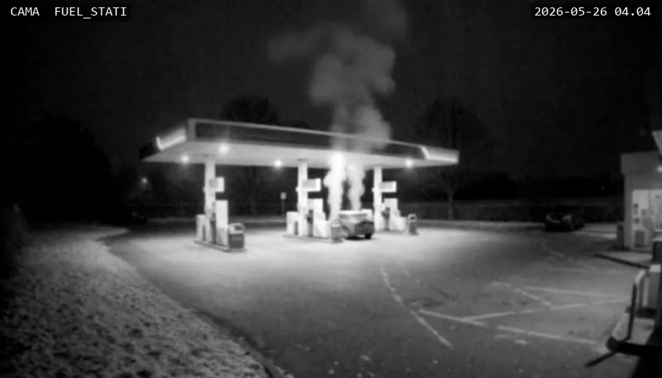 Fuel station at night in infrared: steam rising above the canopy